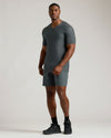 Man wears Charcoal Heather Gray Tall Active V-Neck and matching athletic shorts.