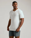 Male model wearing Tall Active V-Neck 3-Pack, fitted white T-shirt.