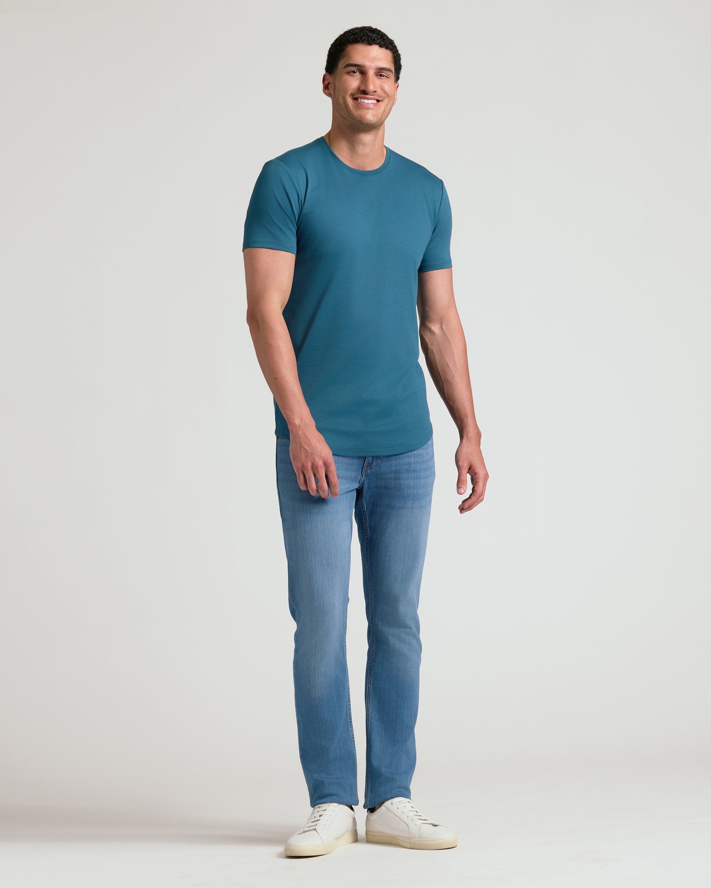 Man wearing Lagoon Tall Premium Pima Crew Curved Hem.