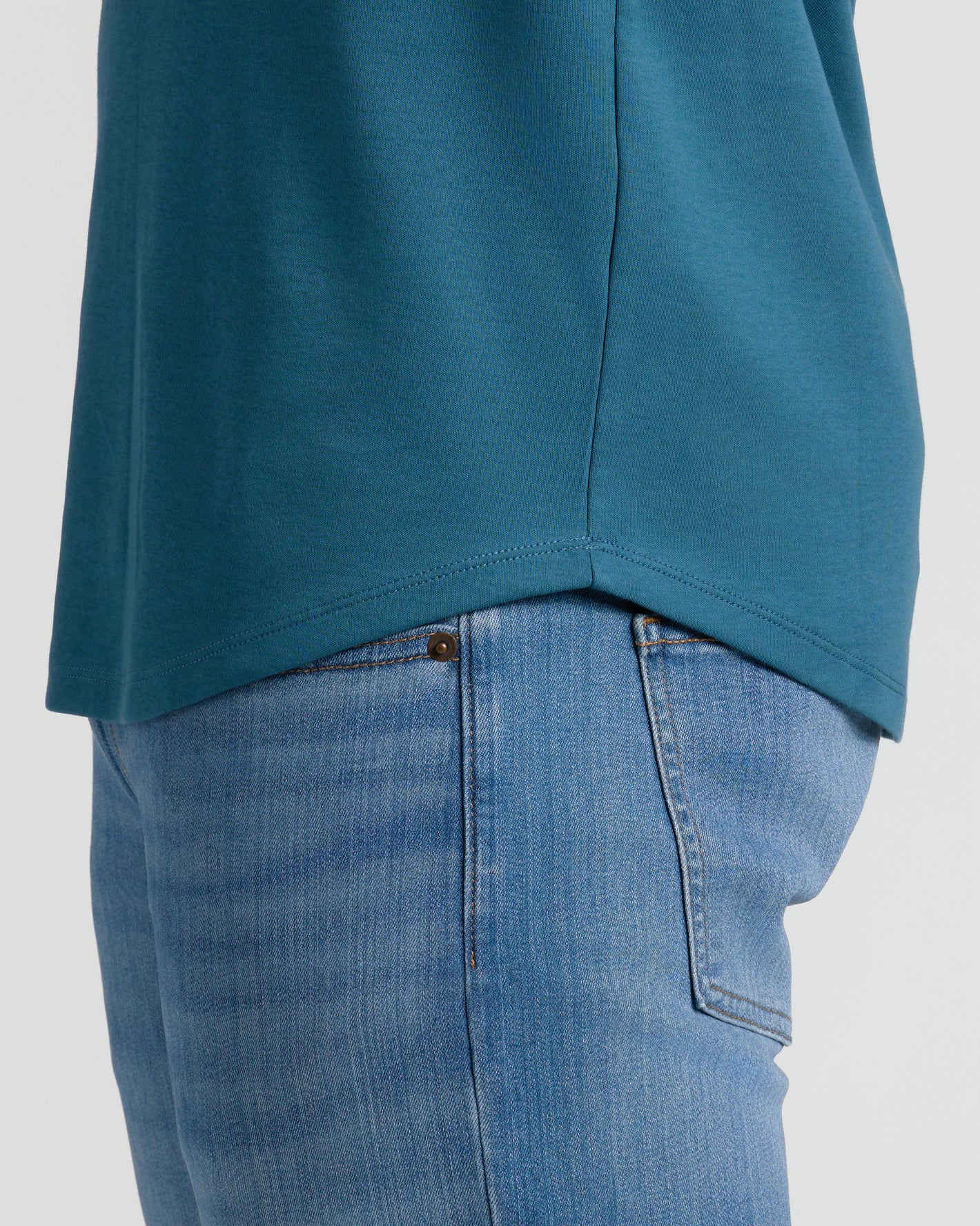 Lagoon Tall Premium Pima Crew Curved Hem over light-wash jeans.
