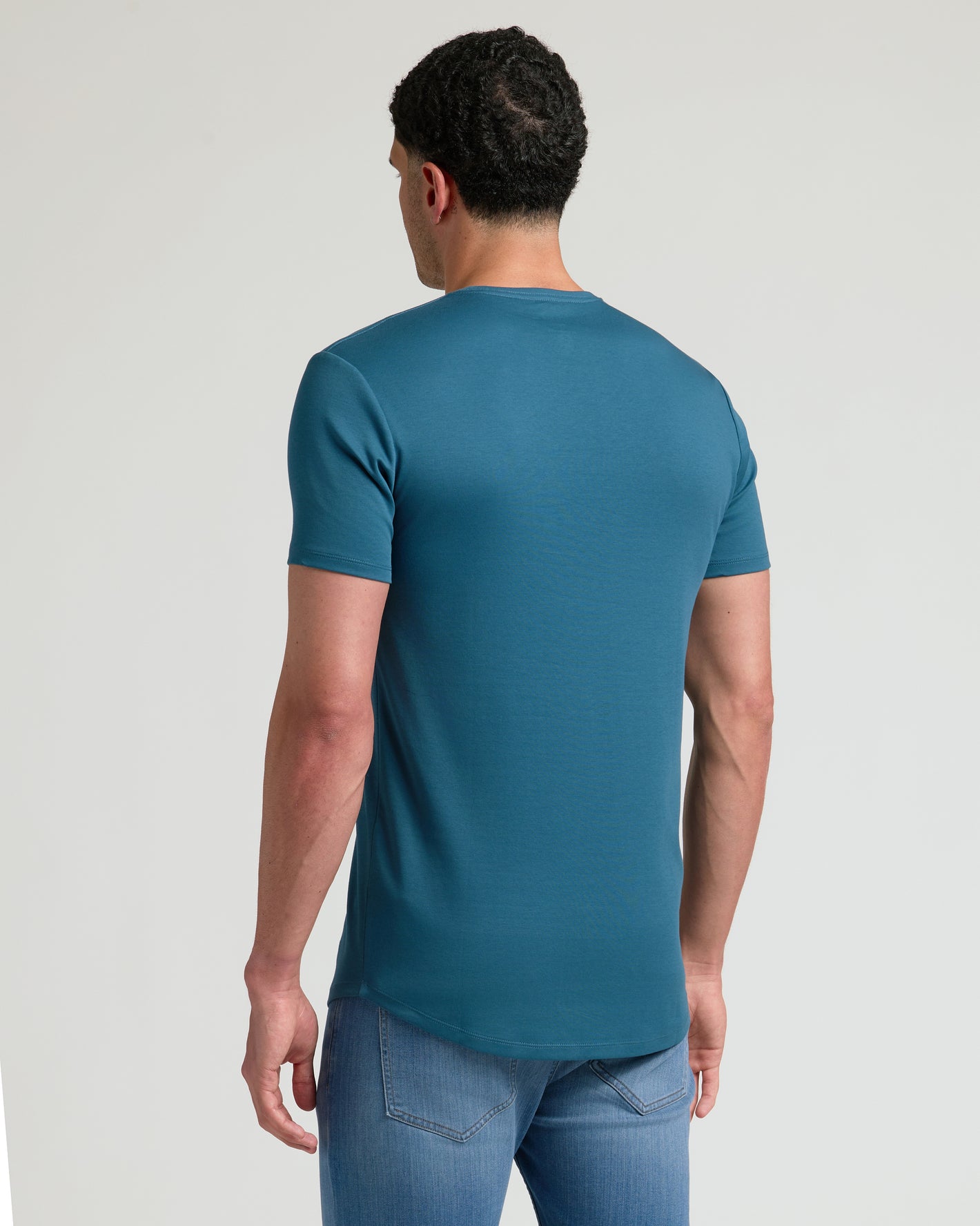 Lagoon Tall Premium Pima Crew Curved Hem worn by a taller frame.