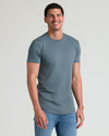 Timeless Tall Premium Pima Crew Curved Hem 4-Pack worn by a smiling man.