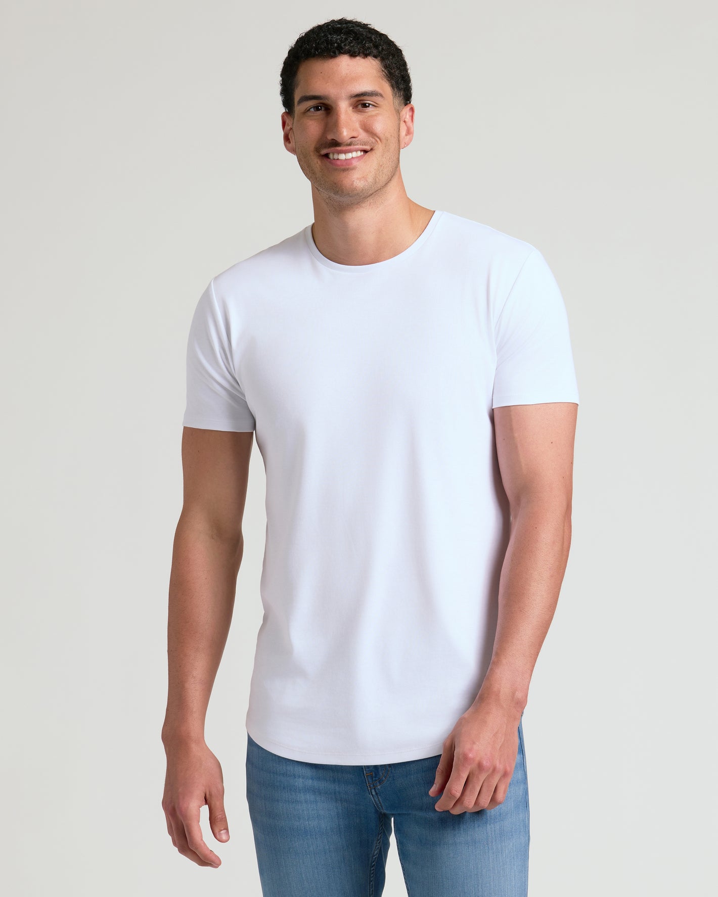 Man wearing Black & White Tall Premium Pima Crew Curved Hem 7-Pack.