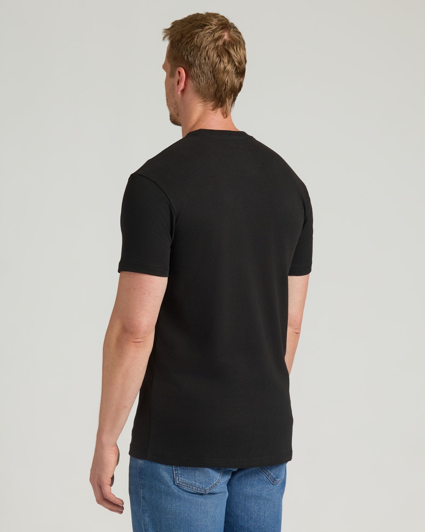 Black Tall Heavyweight Pocket Crew on man, showing extended length fit.