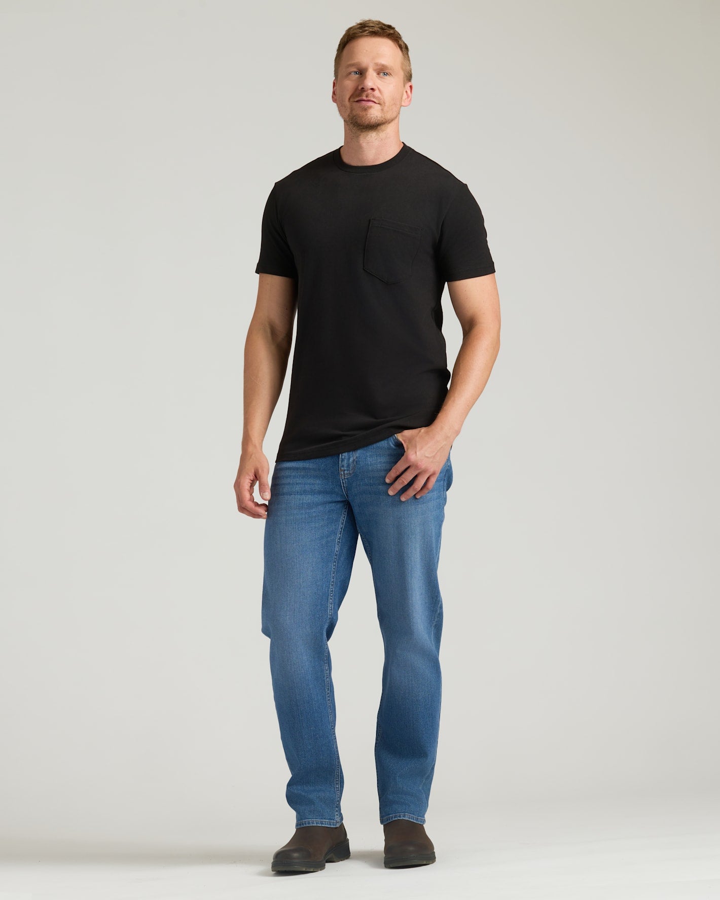 Black Tall Heavyweight Pocket Crew on man in jeans and boots.