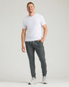 Tall man in Black & Charcoal Heather Gray Tall Active Joggers 2-Pack, smiling.