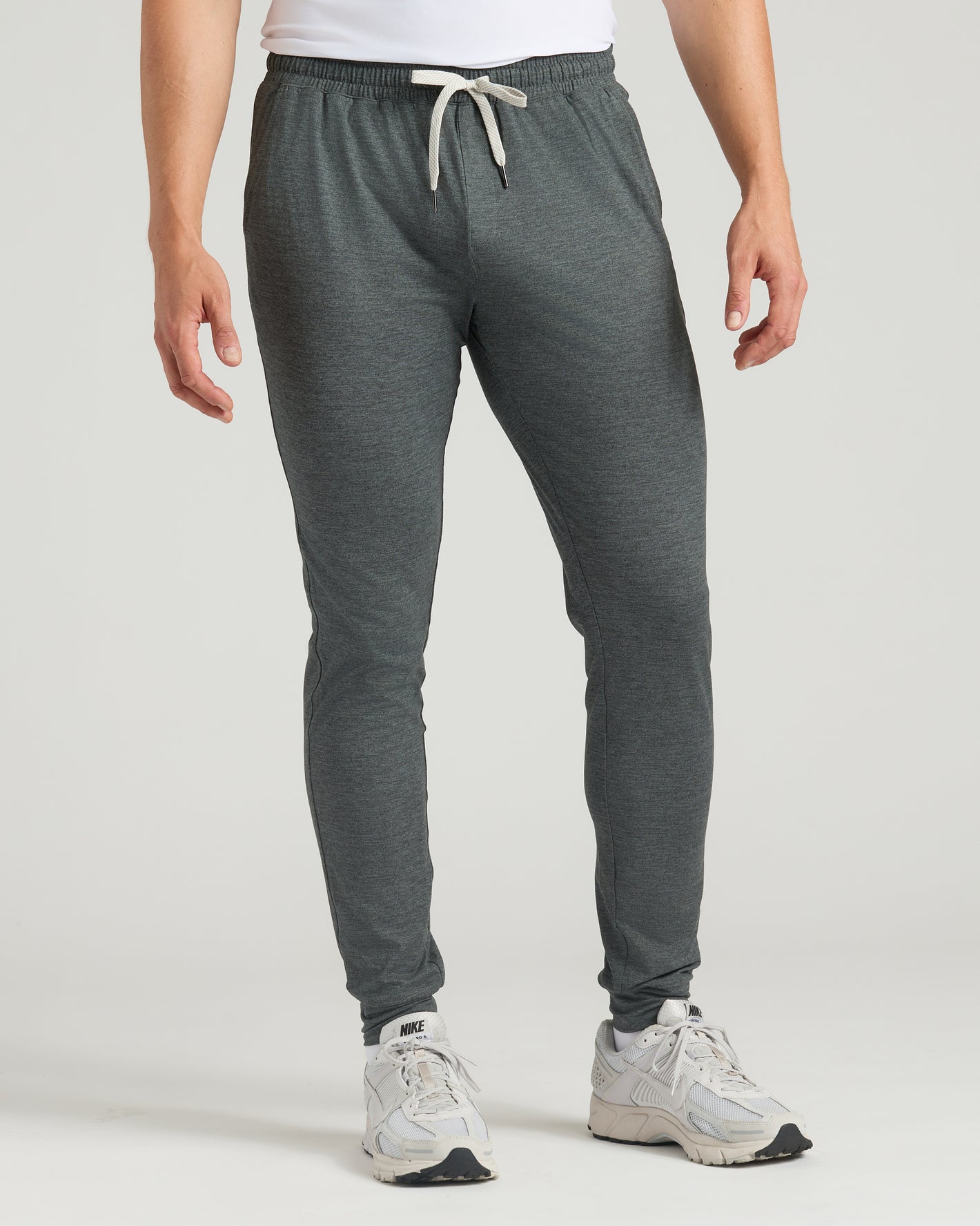 Charcoal Heather Gray Tall Active Joggers with white drawstring and sneakers.