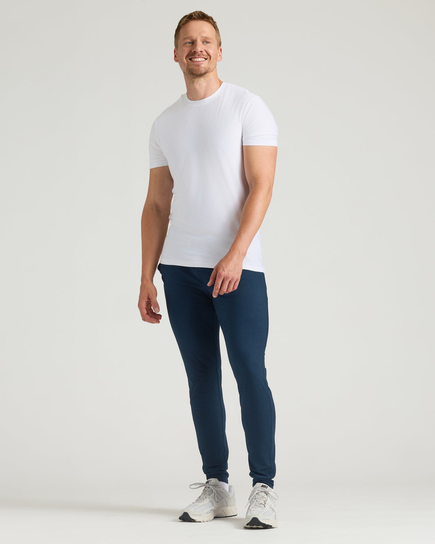 Man wearing Dark Heather Navy Tall Active Joggers, showcasing slim athletic fit.