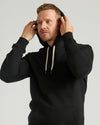 Man wearing Black Tall Fleece French Terry Pullover Hoodie.