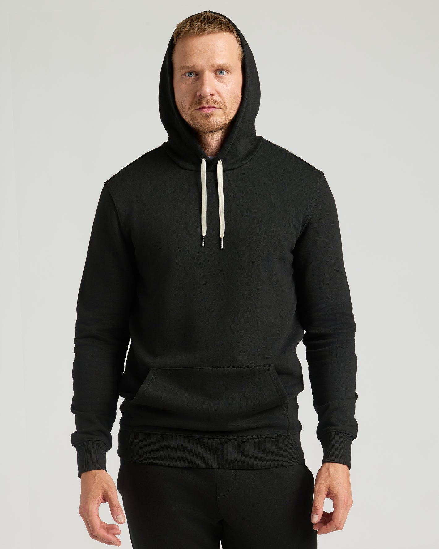 Man wearing Black Tall Fleece Pullover Hoodie & Joggers 2-Pack.