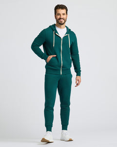 True ClassicMan in Deep Emerald Fleece French Terry Zip Hoodie, smiling.