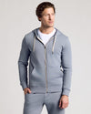 Model in Dusty Blue Fleece French Terry Zip Hoodie.