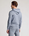 Man wearing Dusty Blue Fleece French Terry Zip Hoodie and joggers.