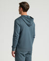 Man wearing Neptune Fleece French Terry Pullover Hoodie from behind.