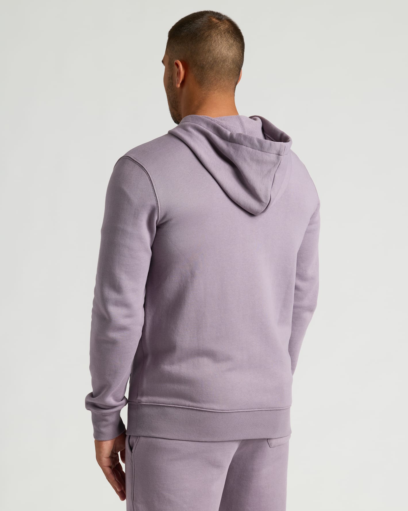 Rear view of Thistle Fleece French Terry Pullover Hoodie on person.