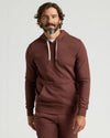 Man in Carob Fleece French Terry Pullover Hoodie and sweatpants.