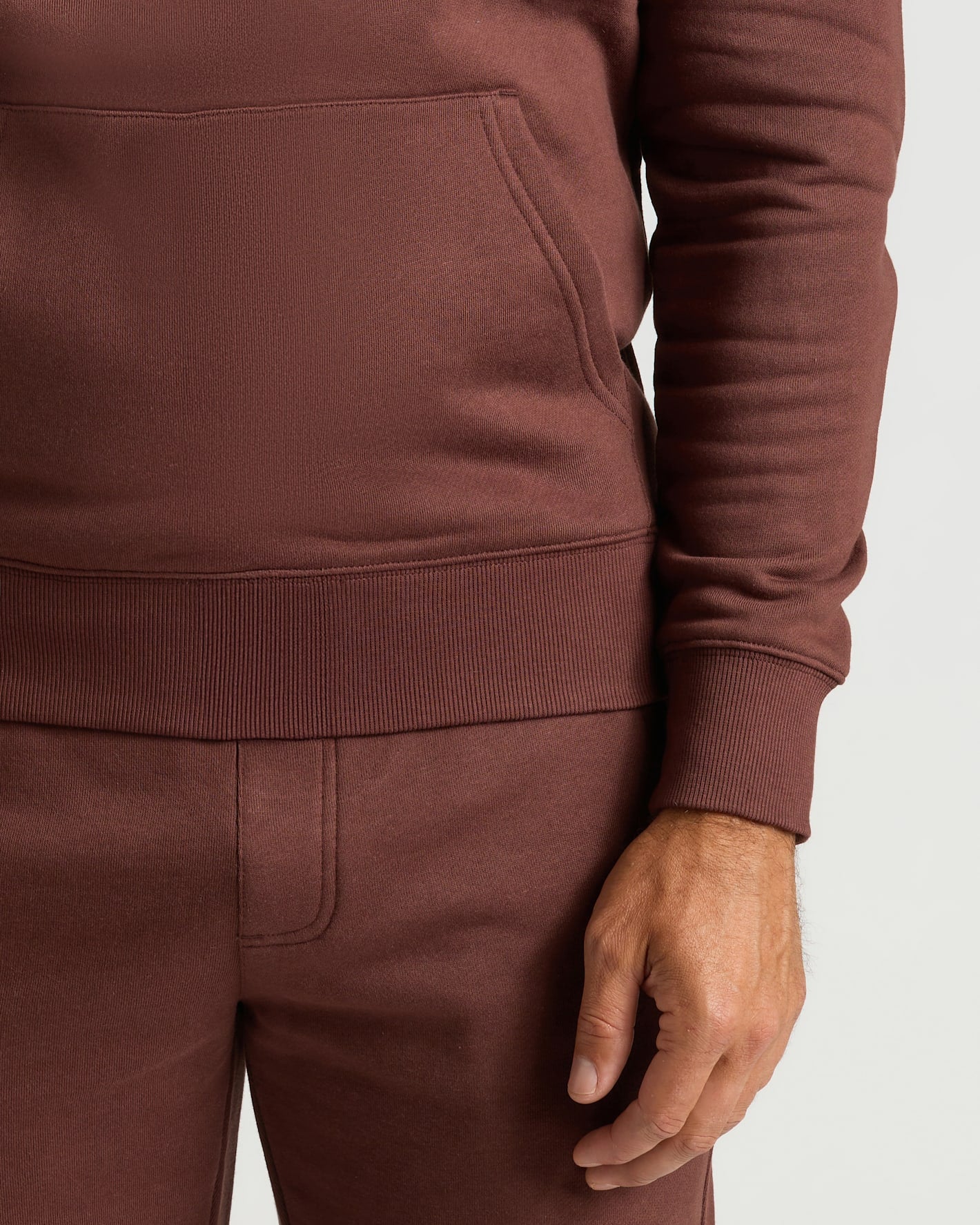 Carob Fleece French Terry Pullover Hoodie with kangaroo pocket and ribbed cuffs.