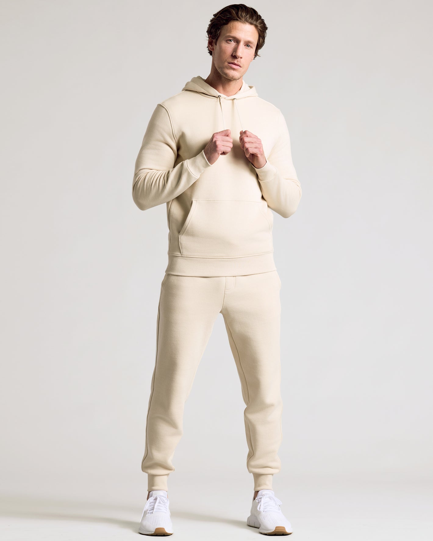 Model wearing Dune Fleece French Terry Pullover Hoodie with joggers.