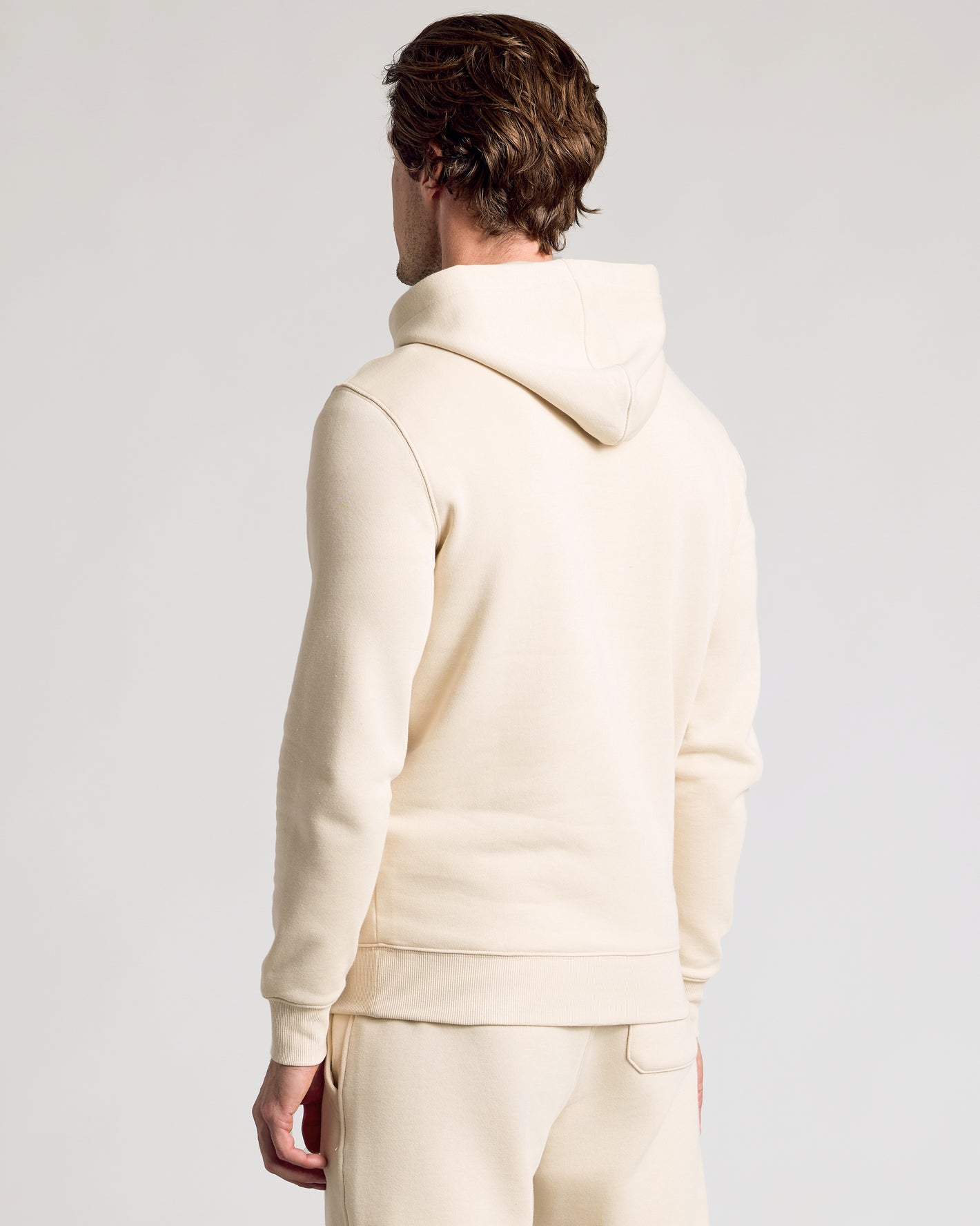 Back view of Dune Fleece French Terry Pullover Hoodie on model.