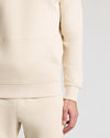 Dune Fleece French Terry Pullover Hoodie with kangaroo pocket and ribbed hem.