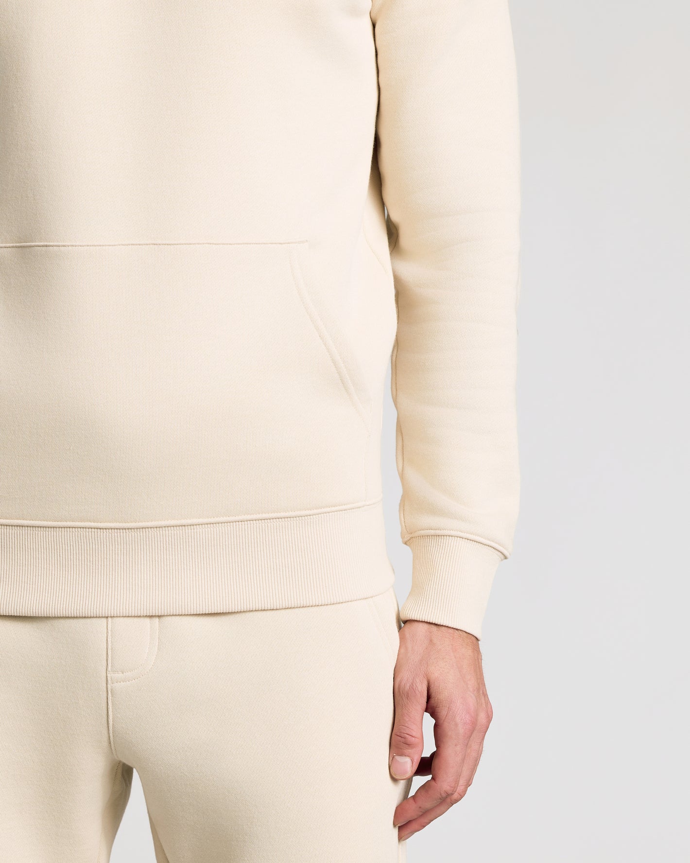 Dune Fleece French Terry Pullover Hoodie with kangaroo pocket and ribbed hem.