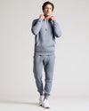 Man in Dusty Blue Fleece French Terry Pullover Hoodie and joggers.