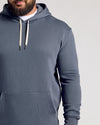 Man wearing Stormy Fleece French Terry Pullover Hoodie with pocket.