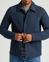 Man fastening Timeless Casual Jacket, showcasing its tailored fit and snap closures.