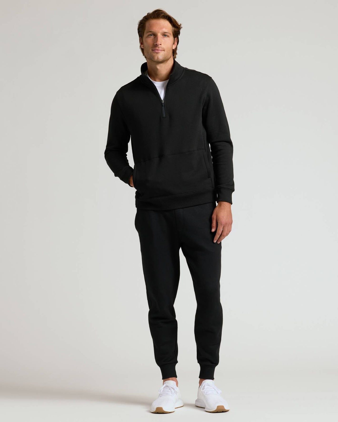 Man wearing Black Quarter Zip Fleece Sweatshirt & Jogger 2-Pack.