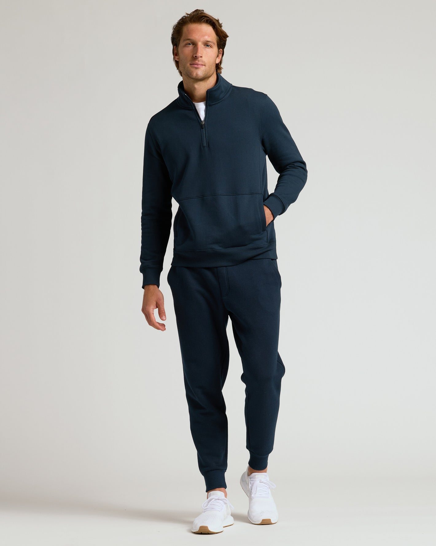 Male model in Navy Half Zip Fleece Sweatshirt & Jogger 2-Pack.