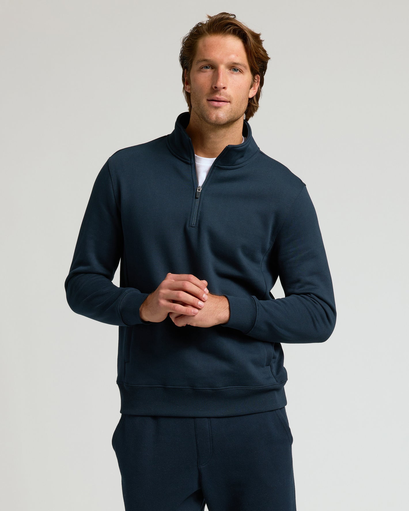 Navy Half Zip Fleece Sweatshirt & Jogger 2-Pack worn by man.