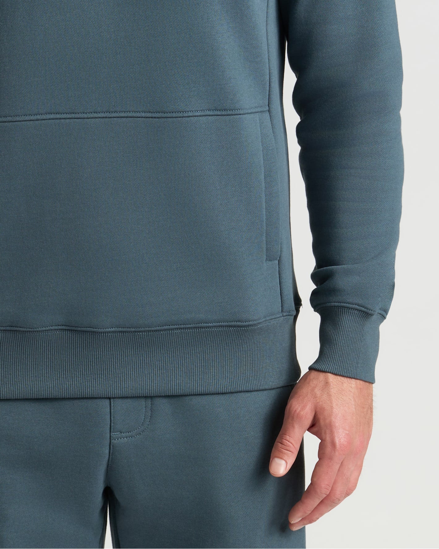 Neptune Half Zip Fleece Sweatshirt with kangaroo pocket and ribbed hem.