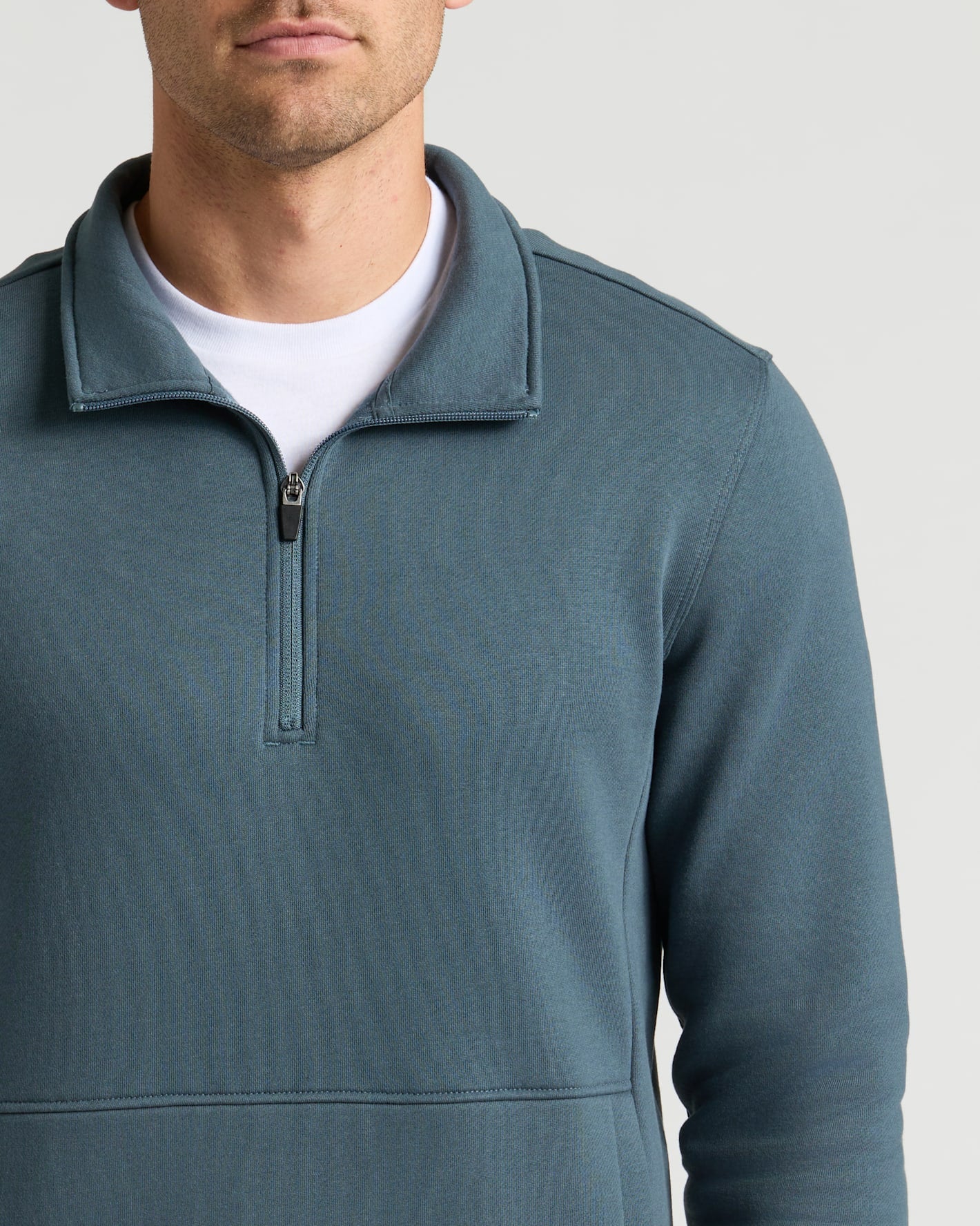 Neptune Half Zip Fleece Sweatshirt with undone zip over a T-shirt.