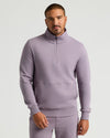 Man wearing Thistle Half Zip Fleece Sweatshirt with kangaroo pocket.
