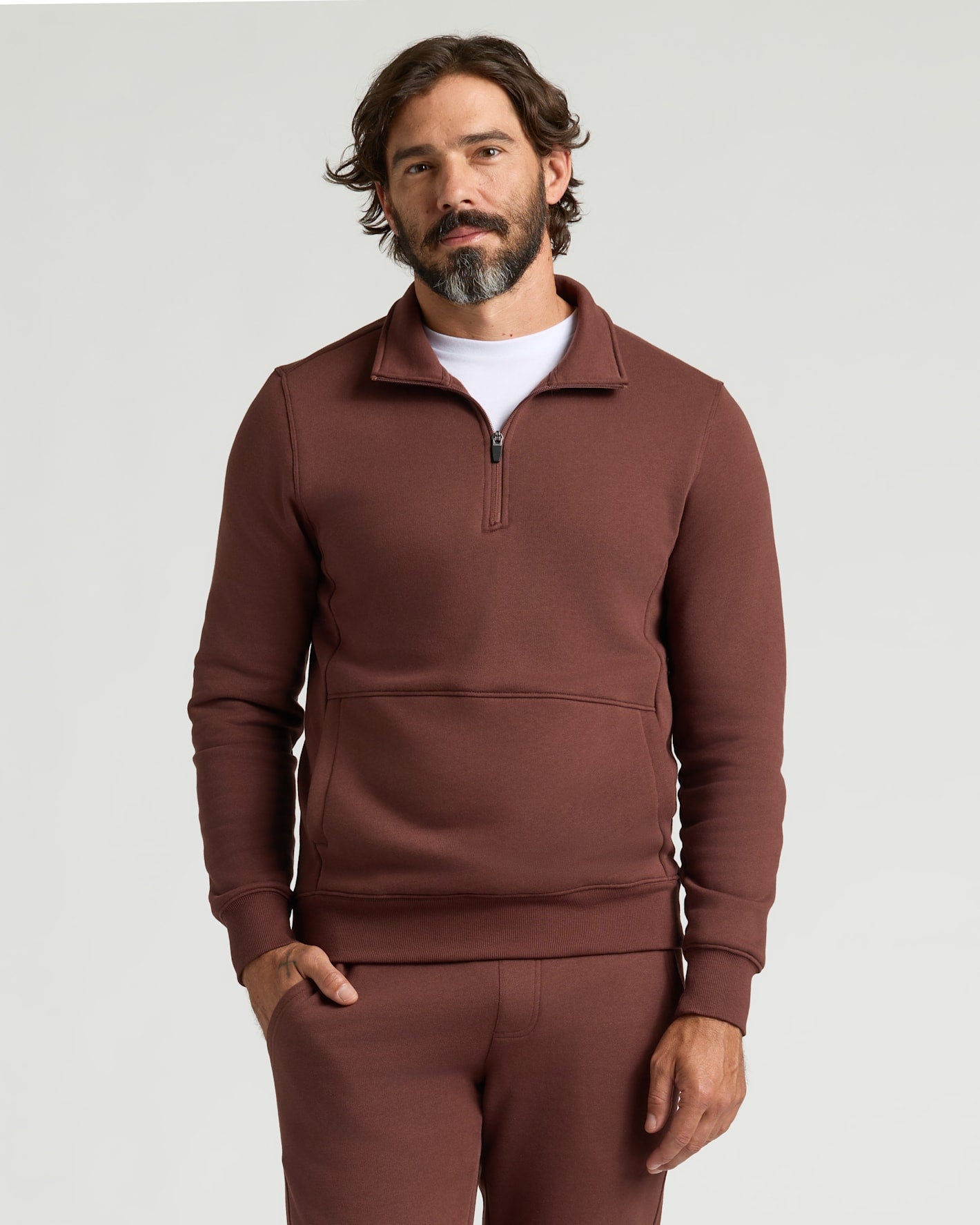 Man wearing Carob Half Zip Fleece Sweatshirt & Jogger 2-Pack.