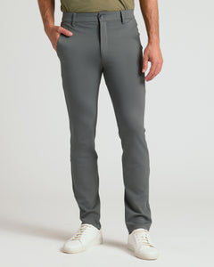 True ClassicSlim Comfort Knit Chino Pant 3-Pack with gray trousers and white sneakers.