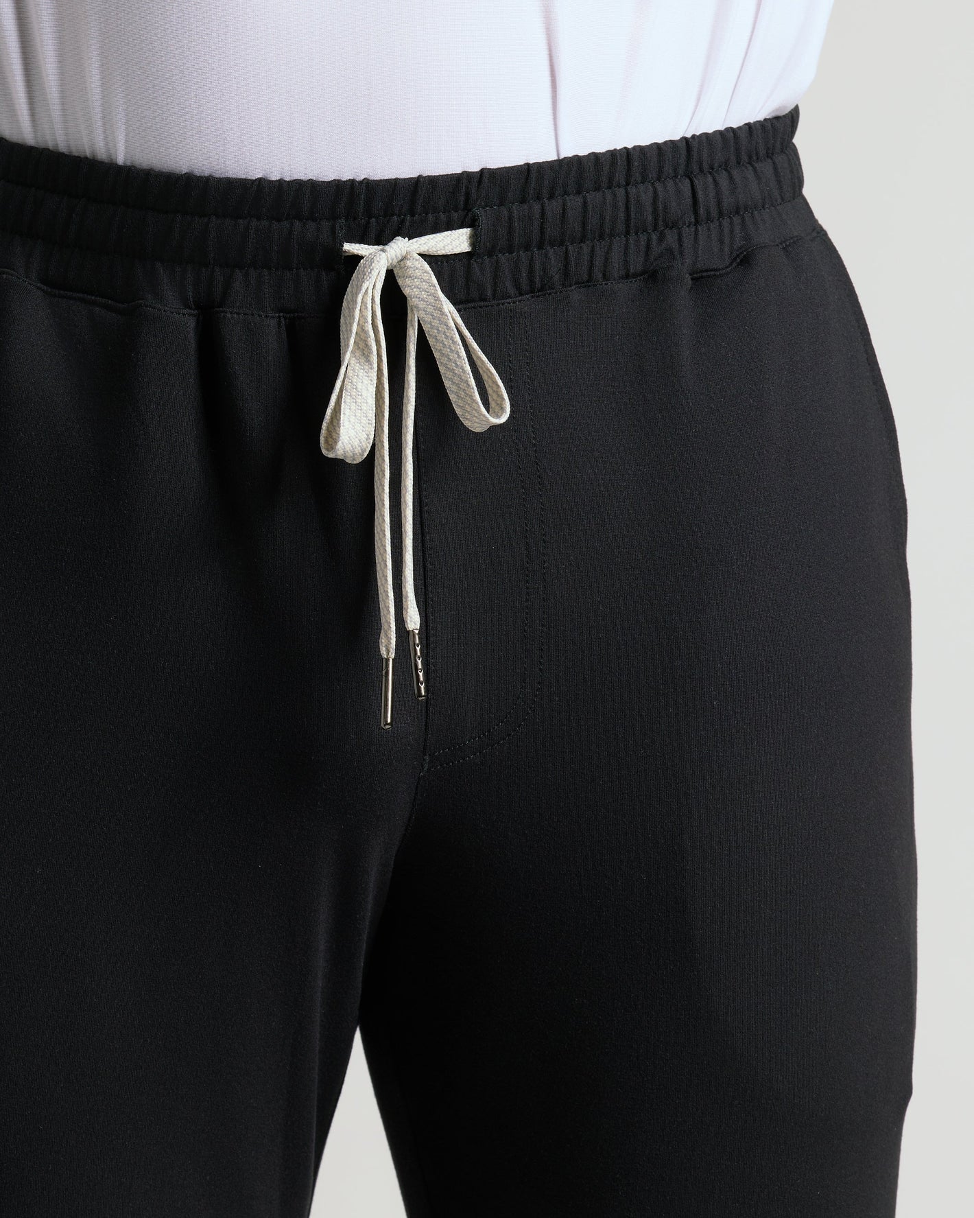Black Active Joggers with white top; elastic waist, off-white drawstring.