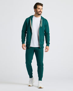 True ClassicModel wearing Deep Emerald Fleece French Terry Joggers with hoodie and sneakers.