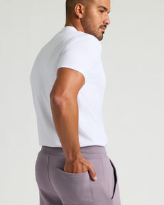 True ClassicMan in Thistle Fleece French Terry Joggers with hand in pocket.