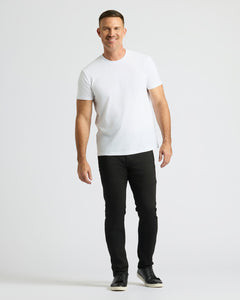 True ClassicMan wearing a white t-shirt and black pants on a white background