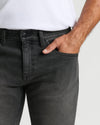 Gray Wash Slim Authentic Denim Jeans with hand in front pocket.