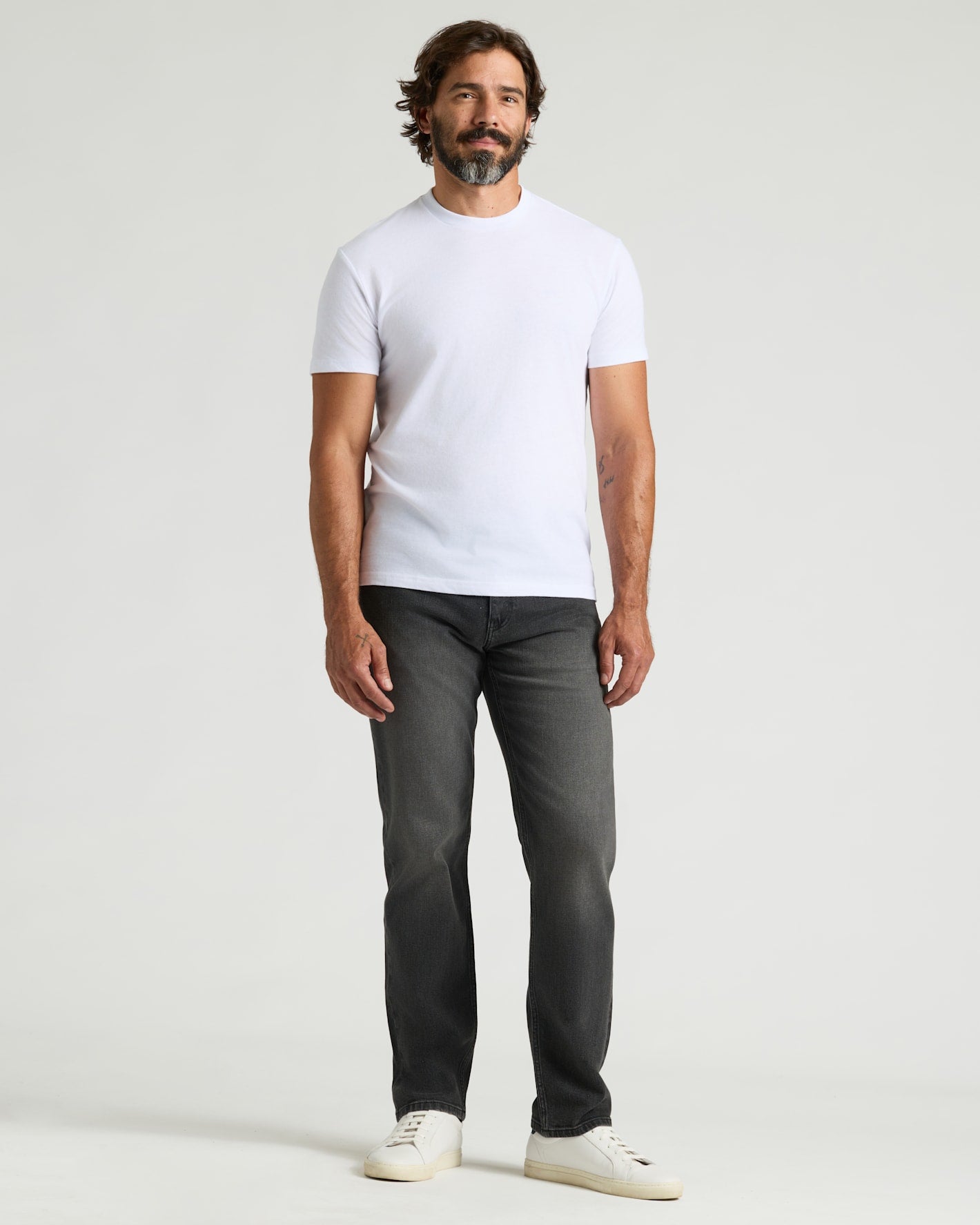 Gray Wash Straight Authentic Denim Jeans modeled with white T-shirt and sneakers.