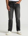 Gray Wash Straight Authentic Denim Jeans with white sneakers, hand in pocket.