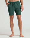 Model wearing 7 Marine Spruce Seersucker Swim Trunks with side pockets.