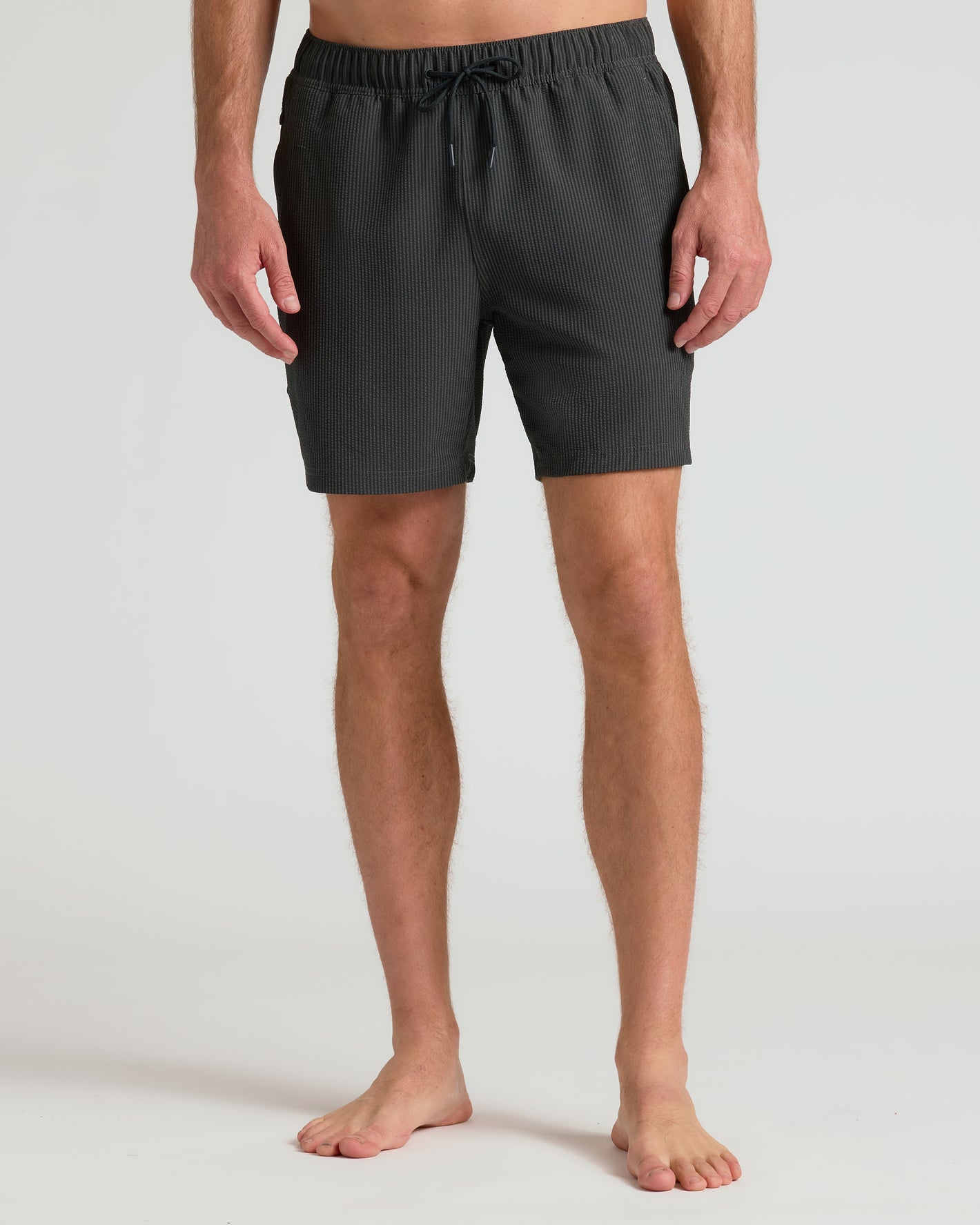 7 Smoke Seersucker Swim Trunks on model, showcasing mid-thigh length.