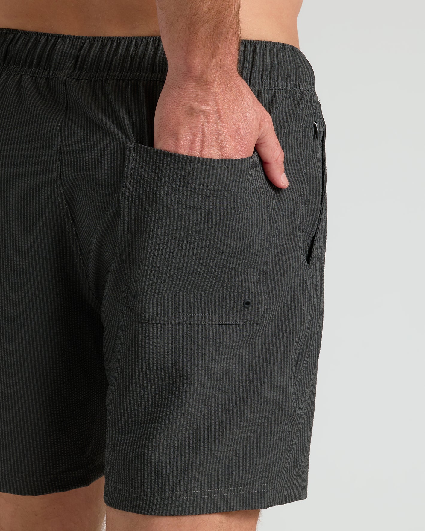 7 Smoke Seersucker Swim Trunks with vertical stripes and elastic waistband.