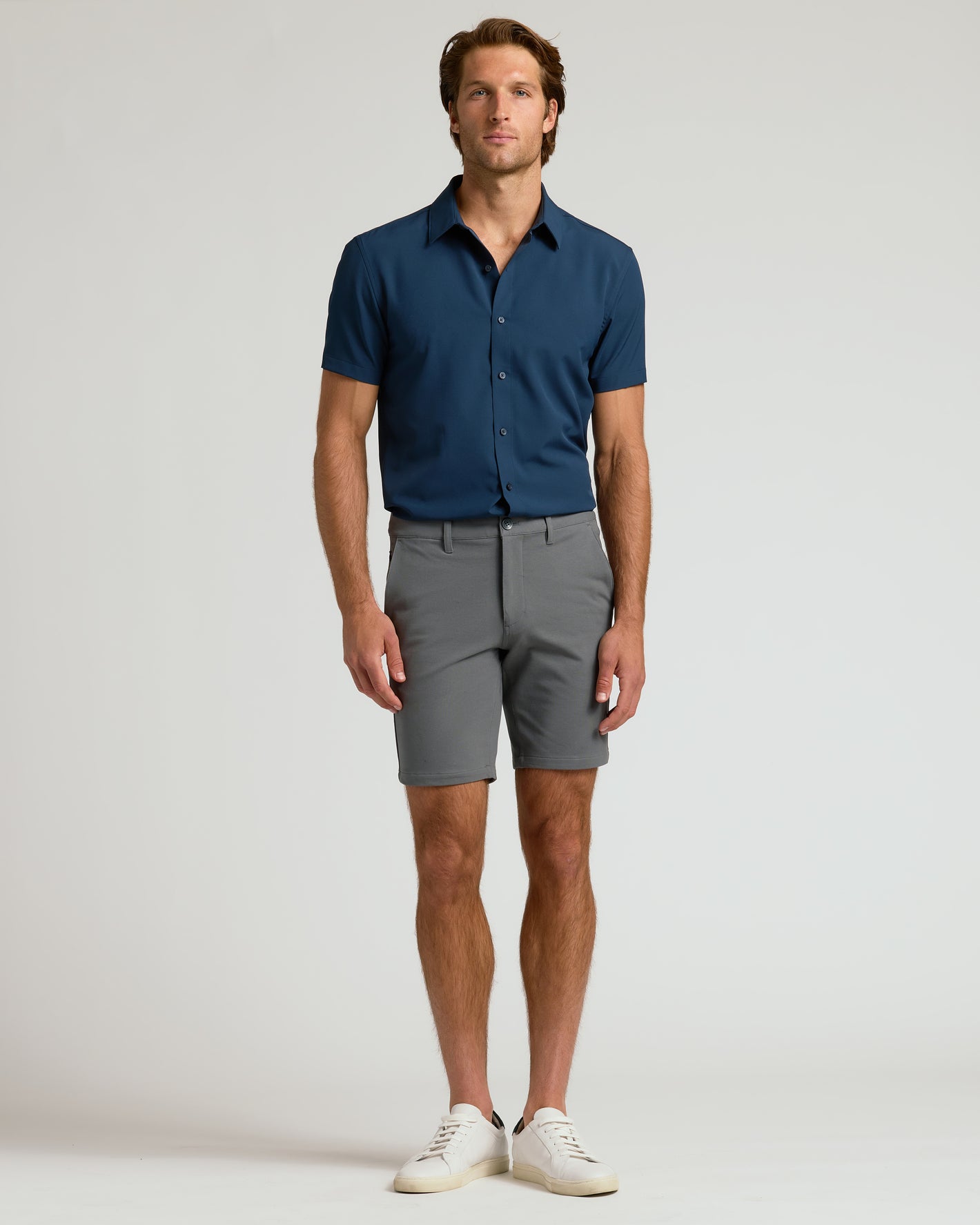Man wearing 9 Carbon Chino Shorts 2.0 in studio.