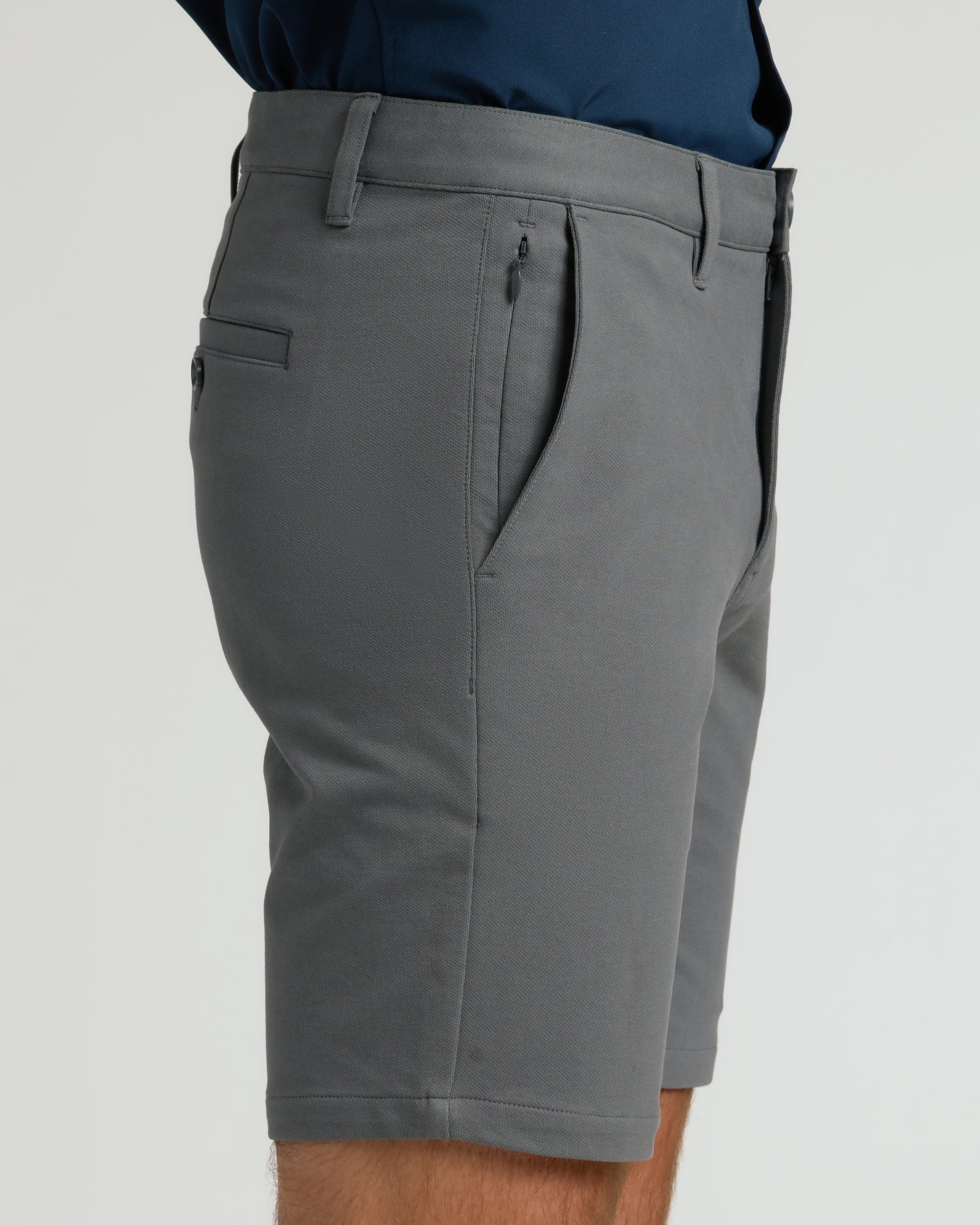 9 Carbon Chino Shorts 2.0 with side zippered pocket and back welt pocket.