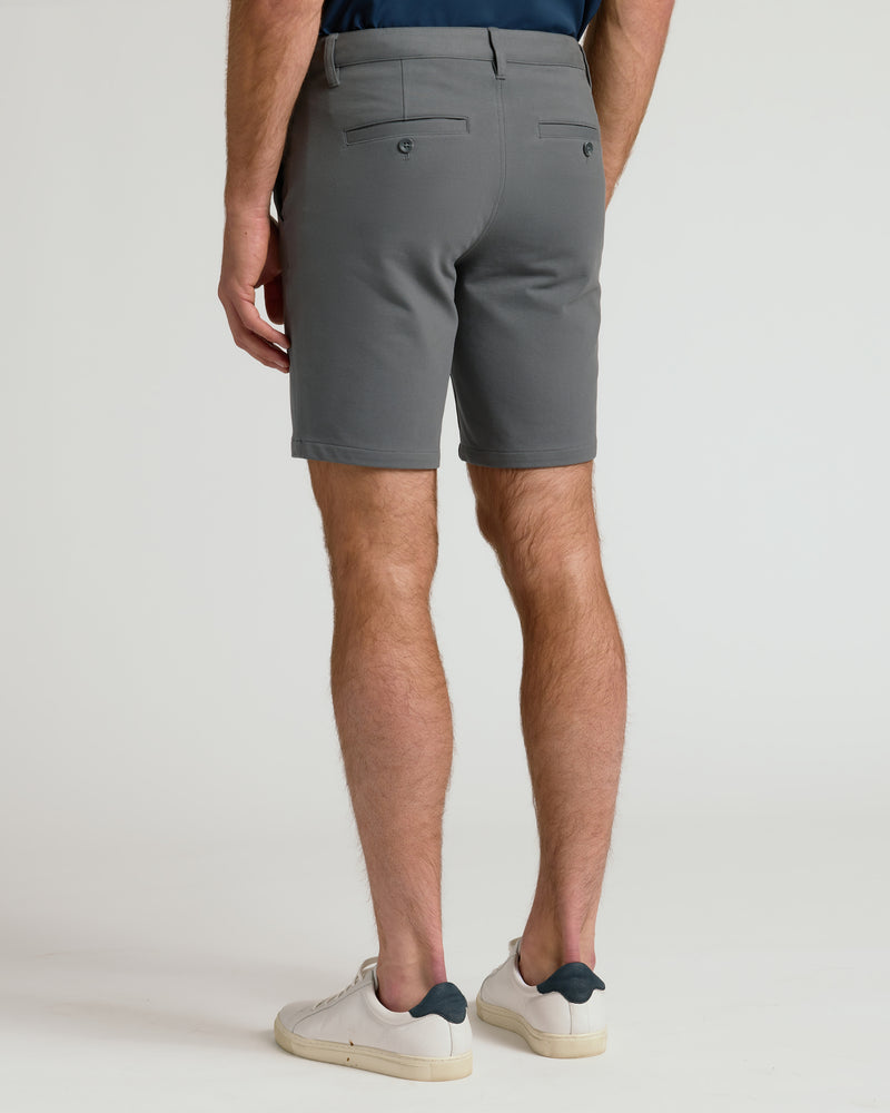 9 Carbon Chino Shorts 2.0, grey, welted back pockets, worn with sneakers.