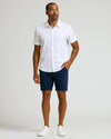 Man wearing 9 Navy Classic Chino Shorts 2.0 and white shirt.
